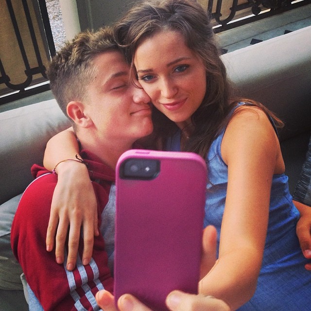 John Abraham Hewson acting to fall asleep on his sister's arms.